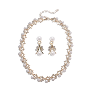 Elegant gold vine jewelry set with white pearls and sparkling rhinestones for weddings