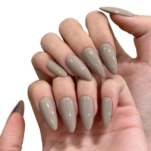 Glossy long almond press-on nails in elegant taupe grey with a smooth mirror finish