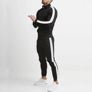 Detailed side view of men's slim fit black tracksuit with white side stripes and stand collar
