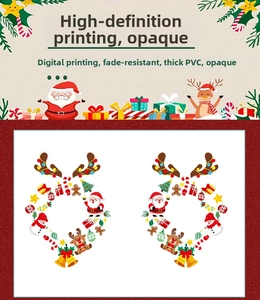 Close-up of thick PVC Christmas static window decals featuring Santa Claus and reindeer