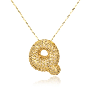 Detailed close-up of golden bubble letter Q pendant necklace with sparkling zircons