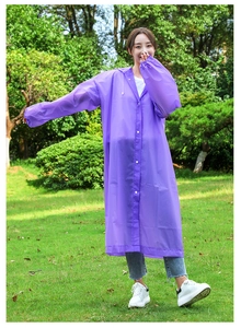 Detail of purple EVA rain poncho with white snap buttons and adjustable drawstring hood