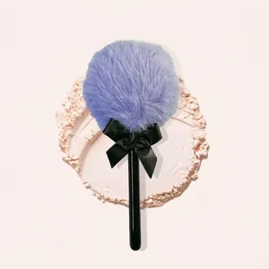 Plush lollipop powder puff with purple fiber head and elegant black silk bow accent