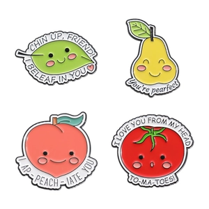 Set of four cute cartoon fruit enamel pins with punny slogans on white background