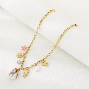 Detailed view of ocean-themed necklace with starfish, seahorse and seashell charms