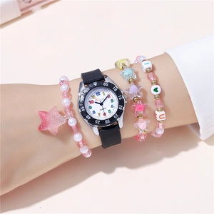 Wrist view of a kids quartz watch with black silicone strap and colorful beaded bracelets