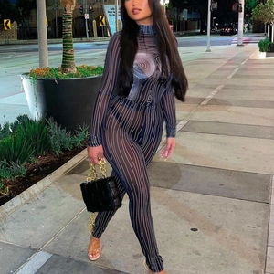 Women's black and white striped sheer mesh jumpsuit with long sleeves and tight fit design
