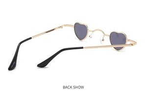 Rear view of heart-shaped sunglasses with gold metal frame and ABA1084 model engraving