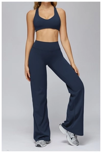 Full view of navy blue high-waisted flare yoga pants and racerback sports bra set
