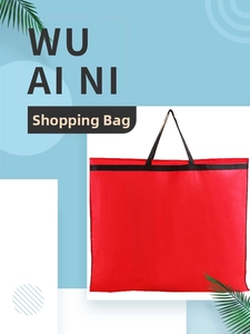 Detail of red and black non-woven wedding dress garment bag with sturdy carrying handles