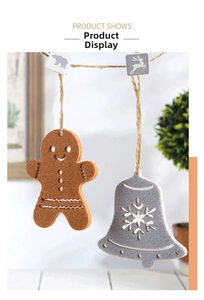 Detail view of gingerbread man felt ornaments with stitching and wooden clips for Christmas