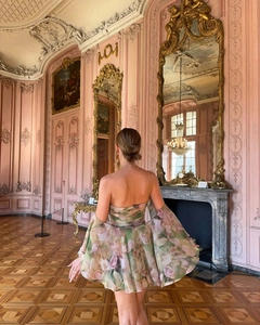 Detailed view of chiffon floral mini dress with ruffled sleeves in a Rococo palace setting