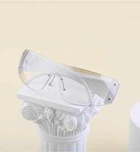 Macro shot of futuristic white Y2K shield sunglasses on a classical white Roman column base