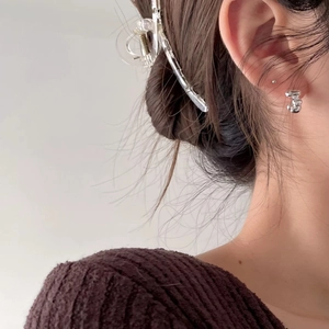 Minimalist 925 sterling silver hair claw and stud earrings set on a model