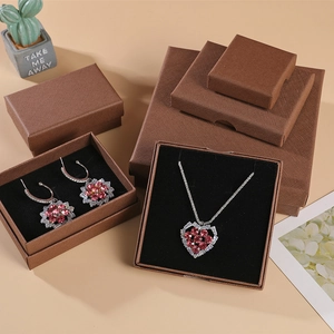 Pink heart crystal necklace and earrings set with brown textured jewelry gift boxes