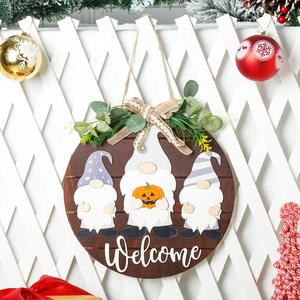 Interchangeable wooden welcome sign featuring holiday gnomes and festive greenery decoration