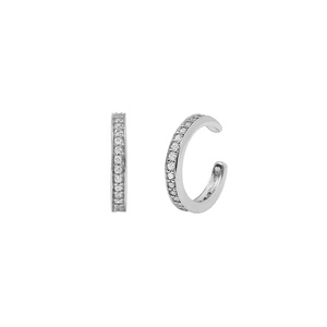 Macro view of silver ear cuffs with pave-set cubic zirconia and minimalist C-shaped design