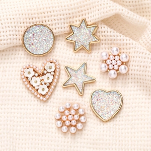 Golden zinc alloy DIY charm set with white pearls and iridescent sequins on mesh fabric