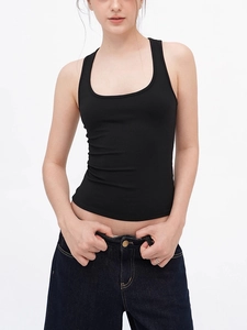 Detail of slim fit U-neck racerback tank top showing black ribbed fabric and stitching