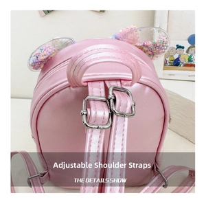 Detail of adjustable shoulder straps on pink sequin bow backpack for kids