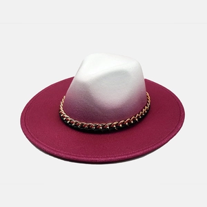 Detailed top view of tie-dye gradient wool fedora with gold and black chain band