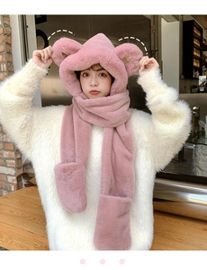Close-up of pink plush 3-in-1 bear hat scarf and gloves set with cute ears on a model