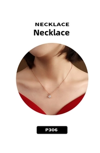 Close-up of rose gold necklace with a round-cut zircon pendant on model neck