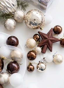 Detailed set of champagne and bronze Christmas balls with matte and glitter textures