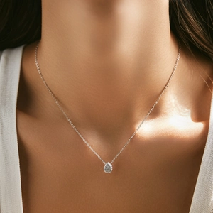 Classic S925 sterling silver necklace with sparkling teardrop pendant on a female model