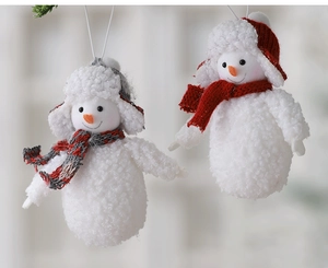 Close-up of plush Christmas snowman ornaments with knitted hats and scarves set of two