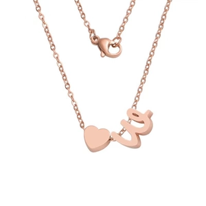 Detail of rose gold necklace with 3D heart pendant and script letter W charm