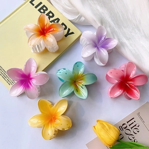 Detailed set of six gradient frangipani flower hair clips in vibrant colorful acrylic