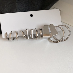 Detailed set of six pairs of minimalist silver geometric hoop and stud earrings
