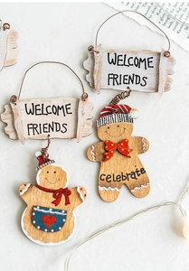Detail of wooden gingerbread man welcome sign with heart patterns for Christmas tree decor