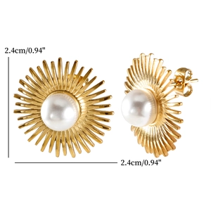 Detail showing gold sunburst stud earrings with white pearls and 2.4cm size marking