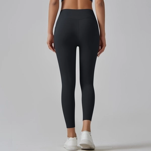 Detail of high-waisted seamless yoga leggings showing lifting cut and matte texture