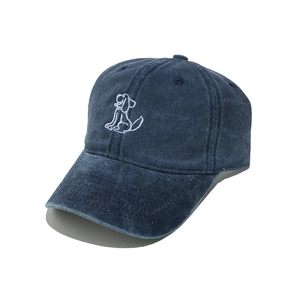 Detailed close-up of white puppy embroidery on a washed navy cotton baseball cap