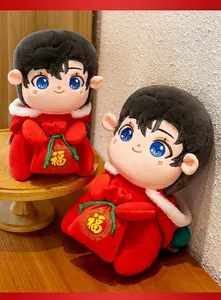 Cute boy plush doll in red festive outfit holding lucky bag for Lunar New Year