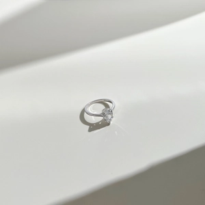 Macro detail of pear cut zircon on S925 sterling silver ring with elegant light reflections
