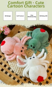Three colorful plush spiders with heart patterns on soft woven mat for gift decor