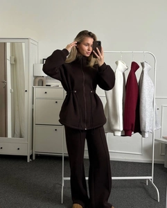 Detail of zip-up cardigan and wide-leg joggers set with drawstring waist in deep brown