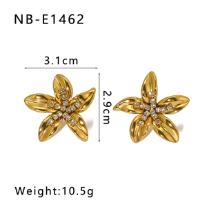 Detailed view of gold flower earrings with rhinestones including size and weight specs