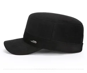 Detail view of the black wool texture and silver SPORT metal badge on the military flat cap