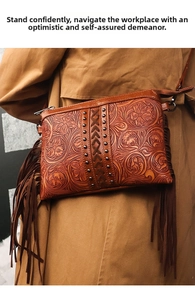 Detail of vintage brown leather bag featuring floral embossing and long side tassels