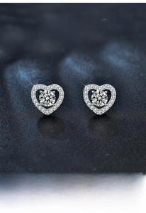 Detail of S925 sterling silver heart earrings with moissanite pave setting