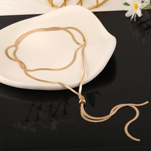 Detail of adjustable gold titanium double-layered snake chain necklace with knot design