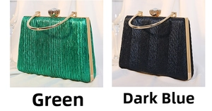 Close-up of pleated metallic evening clutch bags with U-shaped handles and jewel clasps