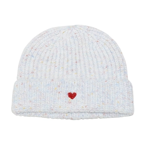 Detailed view of white speckled knit beanie with red heart embroidery and folded cuff