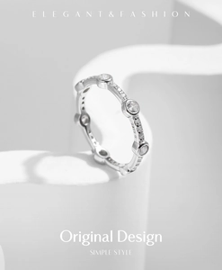 Macro detail of S925 sterling silver ring featuring sparkling geometric row of cubic zirconia