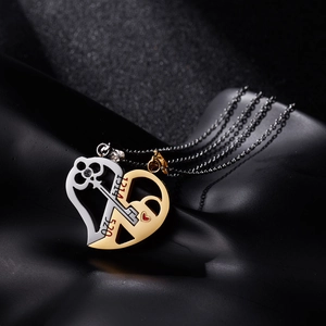 Detail of couple necklaces with 520 and 1314 engraved heart and key pendants